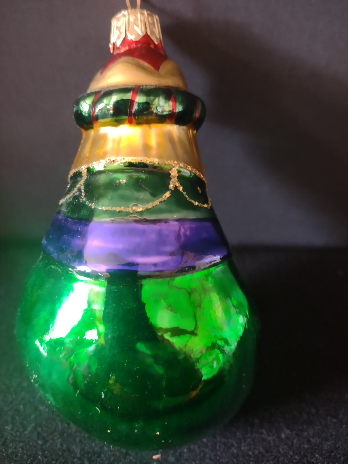 Wise man ornament beside ruler