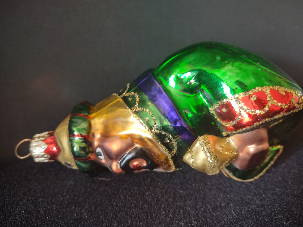 Green glass ornament reverse view