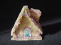 Cream and pink sugar-coated Christmas cottage ornament with blue doorway