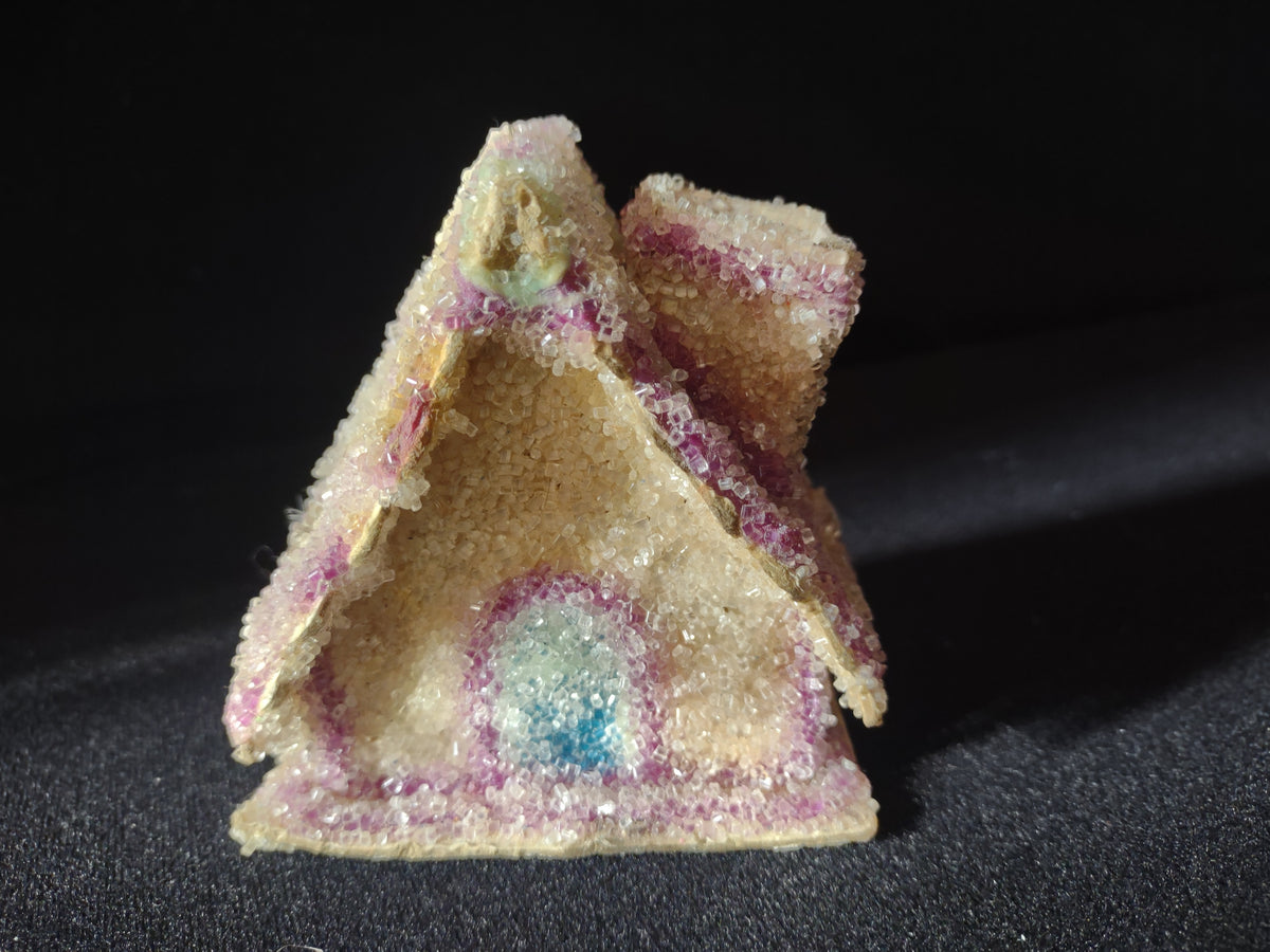 Cream and pink sugar-coated Christmas cottage ornament with blue doorway