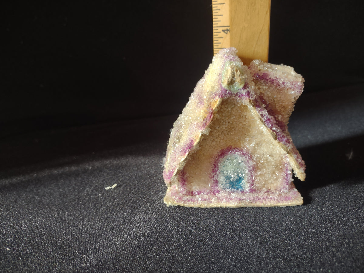 Cottage ornament beside ruler showing approximate height