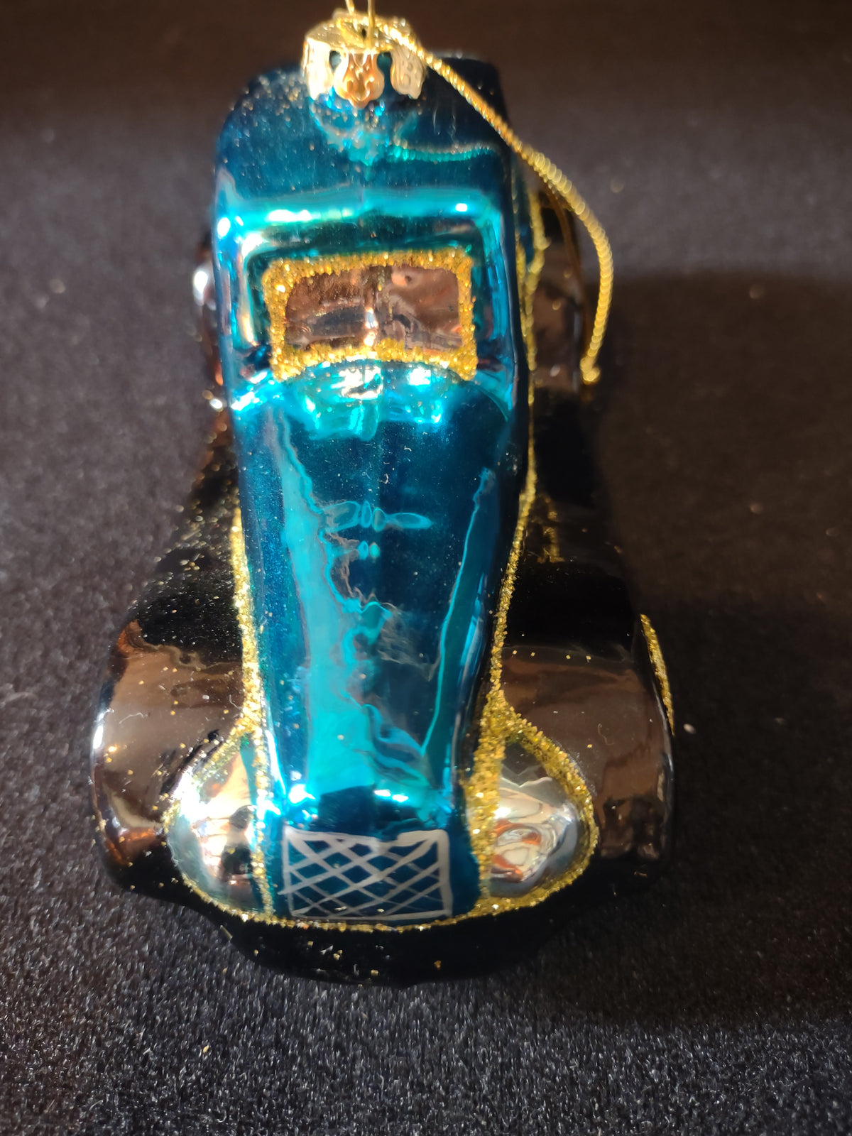Top view of turquoise glass car ornament