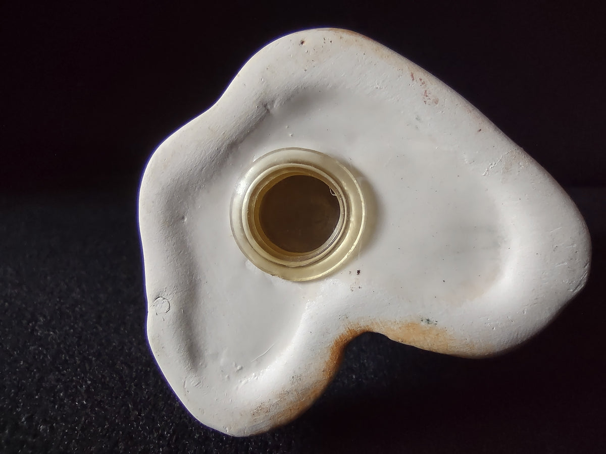 Underside of a bear shaker with stopper