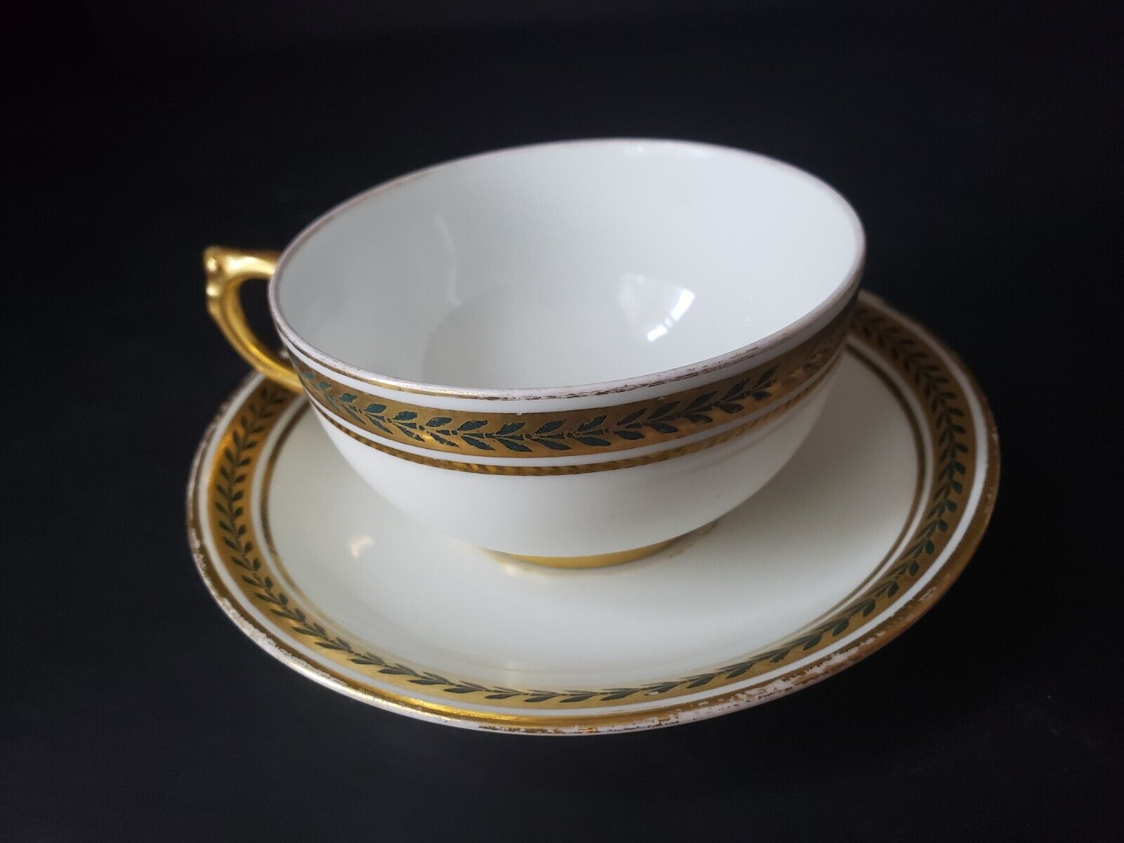 JP Limoges France Gold Trim Green Laurel Teacup & Saucer (lot 600)