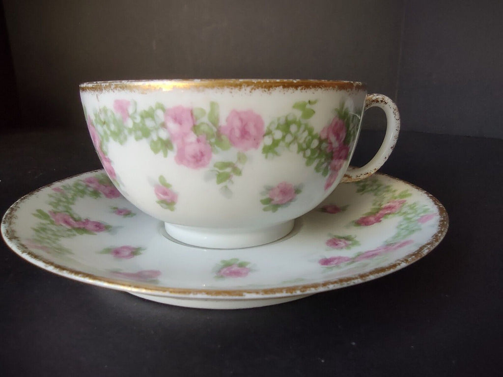 JP France Porcelain for T.G. Evans Tea Cup and Saucer Rose Garland (lot 833)