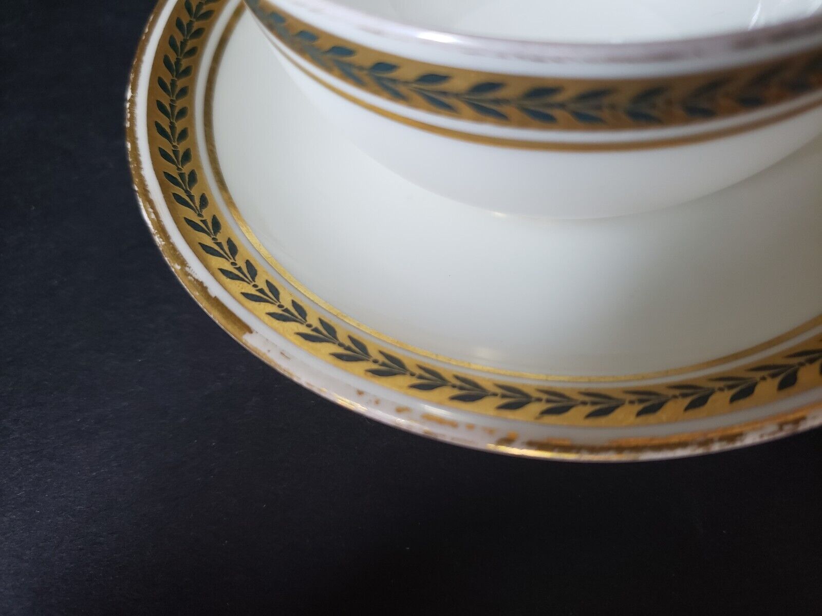 JP Limoges France Gold Trim Green Laurel Teacup & Saucer (lot 600)