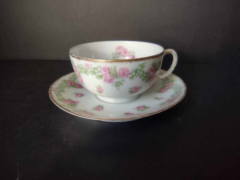 JP France Porcelain for T.G. Evans Tea Cup and Saucer Rose Garland (lot 833)