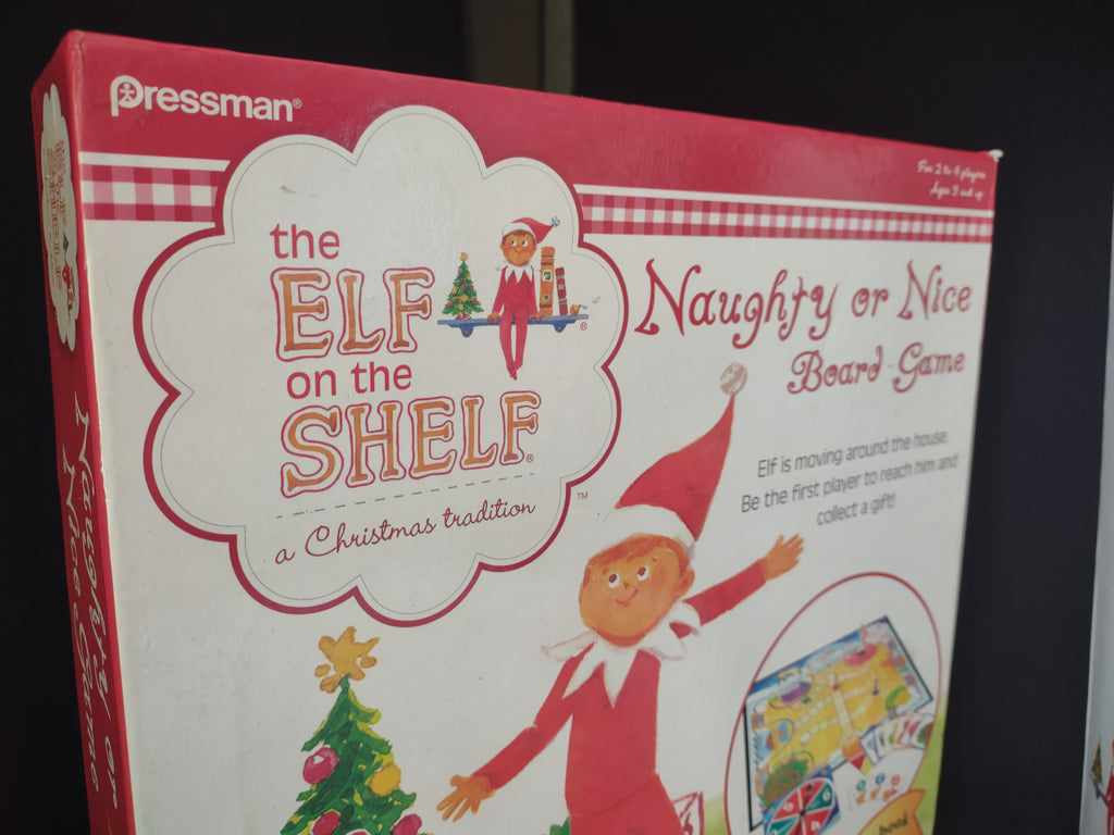 Set Books and Blue Eyes Brown Hair Elf and Naughty Nice Board Game (lot 1724)