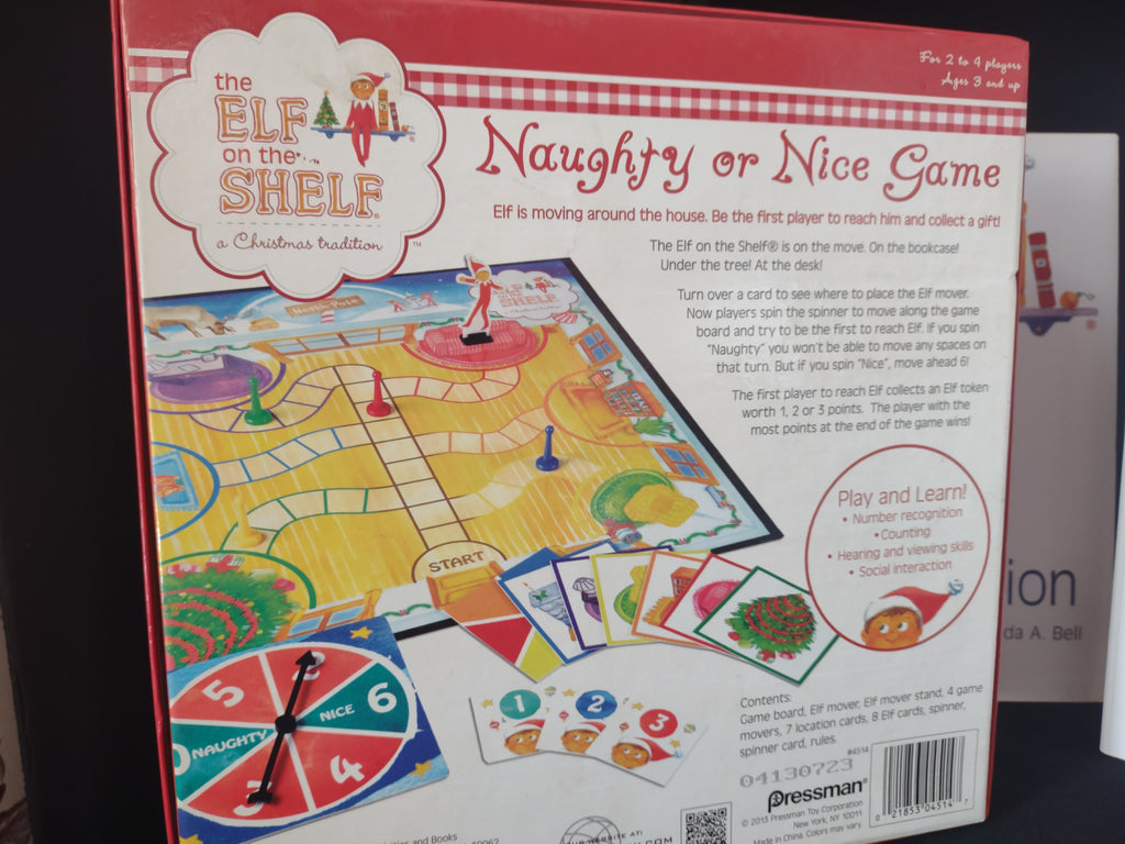 Set Books and Blue Eyes Brown Hair Elf and Naughty Nice Board Game (lot 1724)