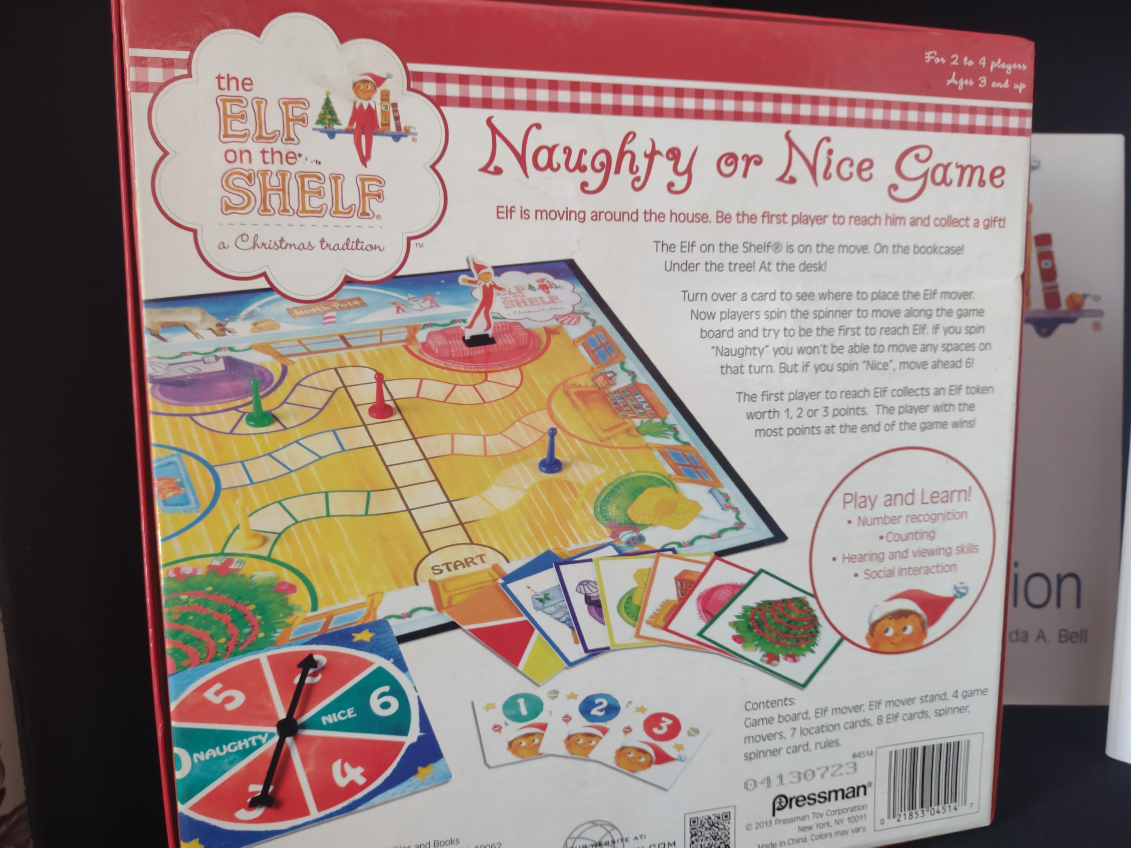 Set Books and Blue Eyes Brown Hair Elf and Naughty Nice Board Game (lot 1724)